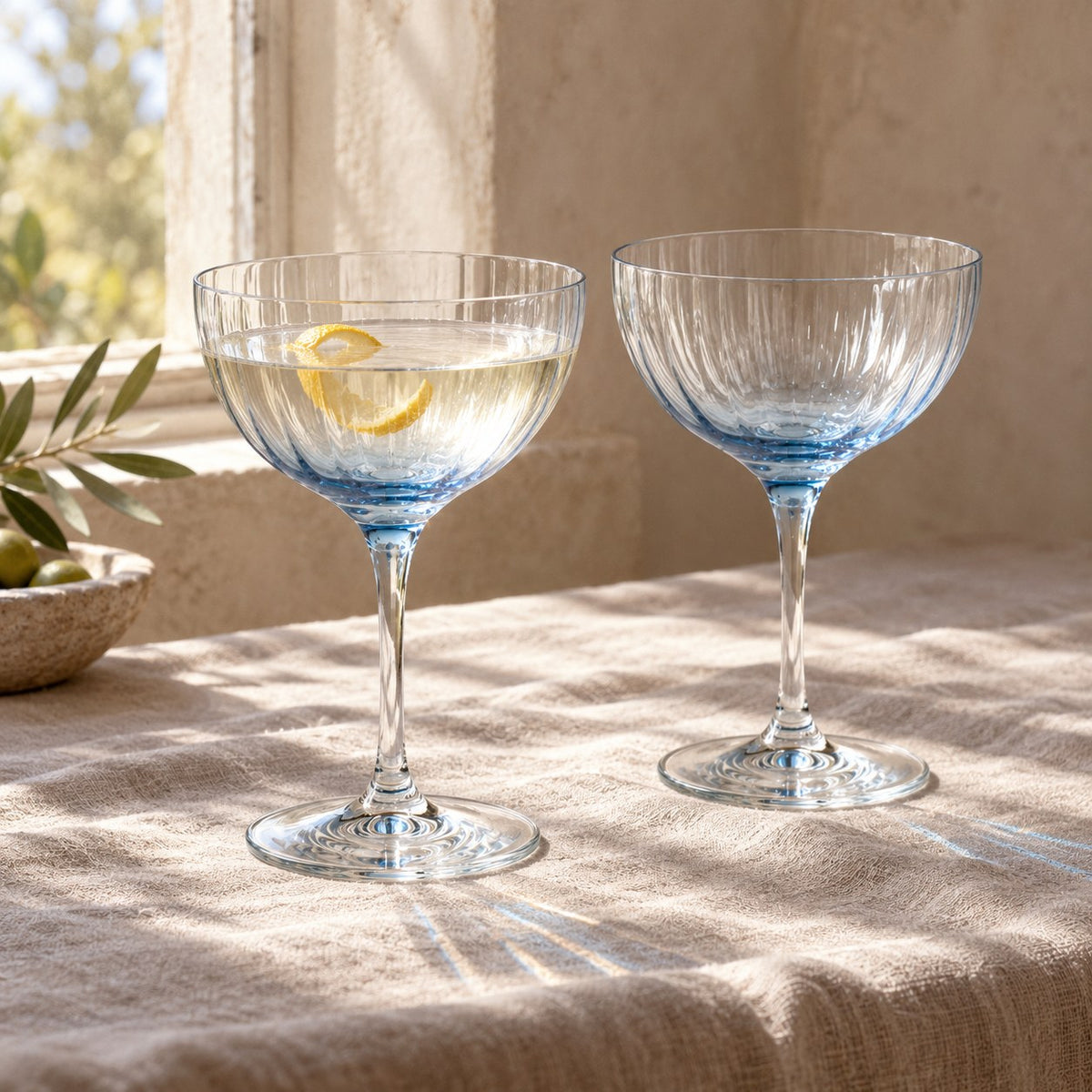 Lume Delft reeded coupes in window light with a martini