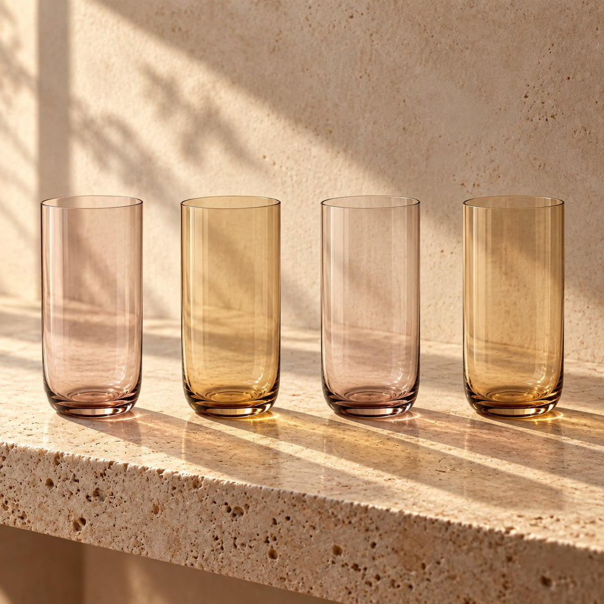 Marver Alabaster and Ochre highball glasses, set of four on a travertine shelf