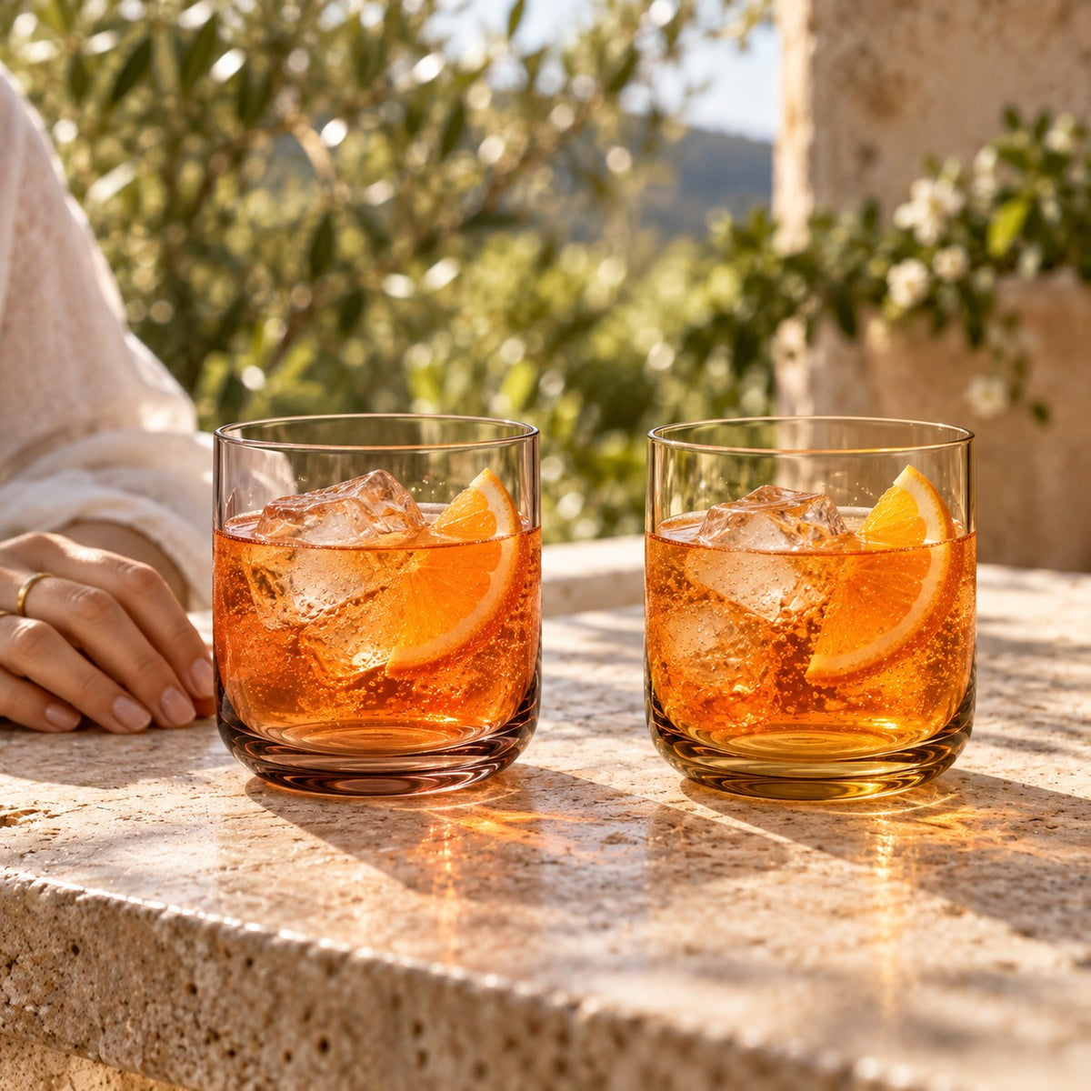 Marver Alabaster and Ochre old fashioned glasses with a summer spritz on a terrace