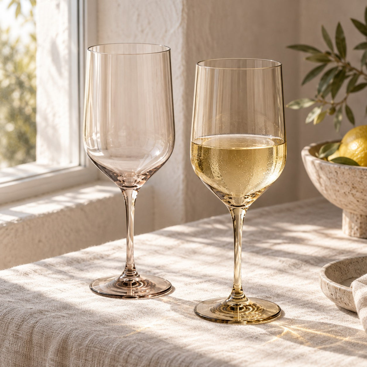 Marver Alabaster and Ochre wine glasses in window light with white wine